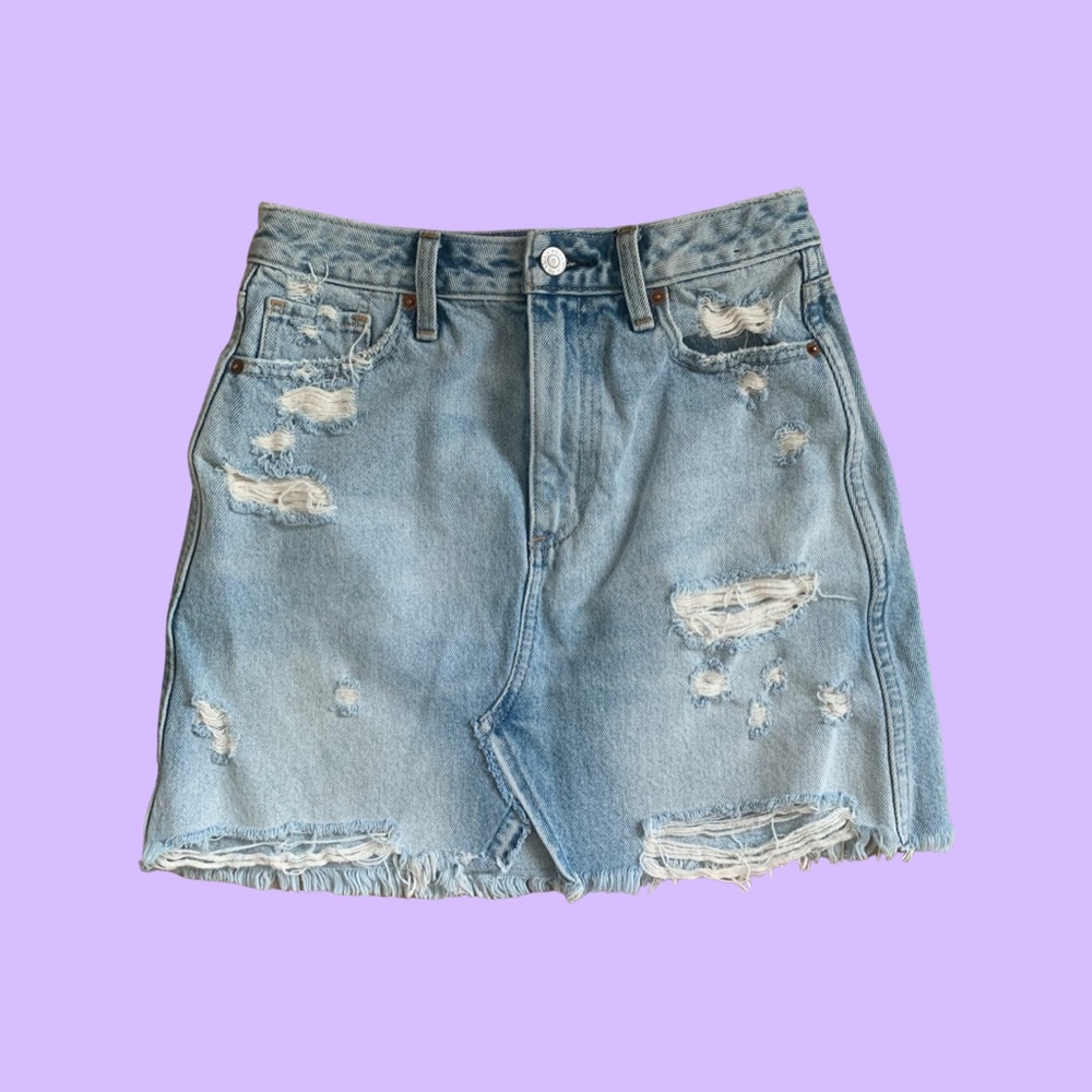 Distressed jean skirt.